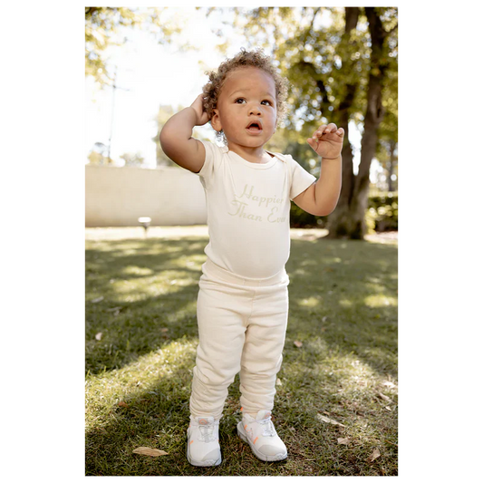 HAPPIER THAN EVER ORGANIC BEIGE ONESIE