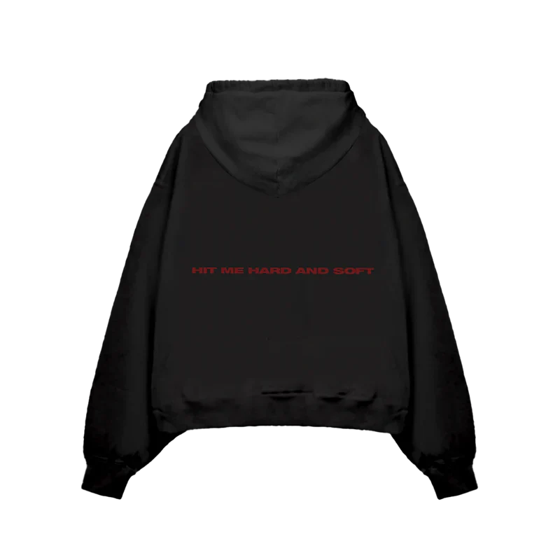 Back view of Billie Eilish Hit Me Hard And Soft Black Cover Pullover Hoodie with text 'HIT ME HARD AND SOFT' in red.